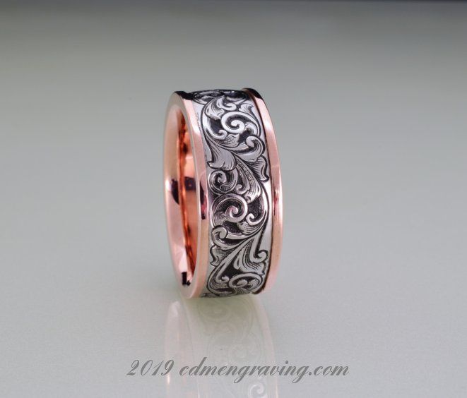 Hand engraved 14k rose gold and stainless wedding band