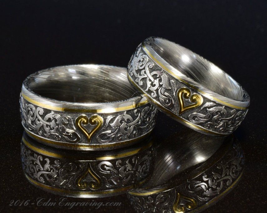 Hand engraved wedding bands in damascus and 18k gold