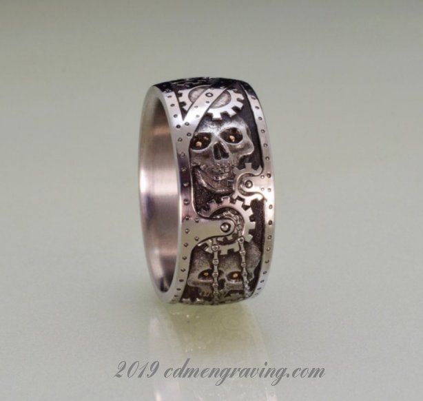 hand engraved titanium steampunk ring with 18k red gold eyes